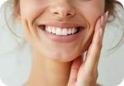 Smiling woman holding her cheek