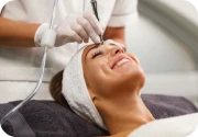 Woman receiving microdermabrasion